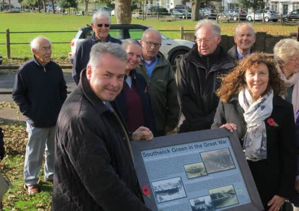 East Worthing and Shoreham MP Tim Loughton and Southwick Society chairman Mary Candy with one of the information boards at the unveiling ceremony