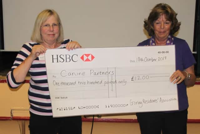 Goring Residents' Association social secretary Alison Chapman presented a cheque to Canine Partners