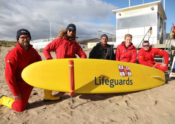 Lifeguards at Camber with Rob Cass (centre), coastal officer for the beach. Photo by Kt Bruce