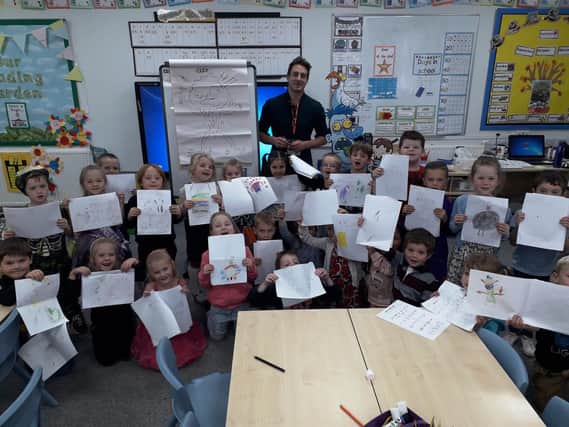 Illustrator Aaron Blecha with year-one children at Glebe Primary School in Southwick