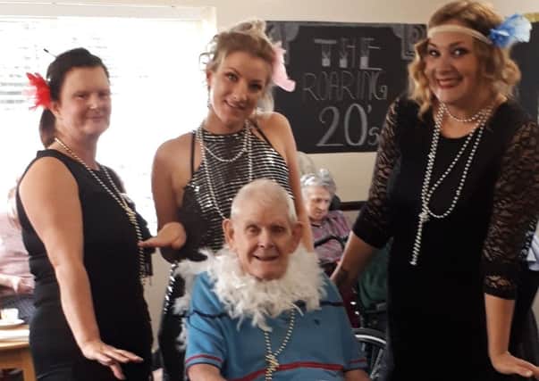 Donna, carer, Caron, carer, Emma, activities organiser and Pat Patterson, resident, enjoying the 1920s themed event at Cavell House