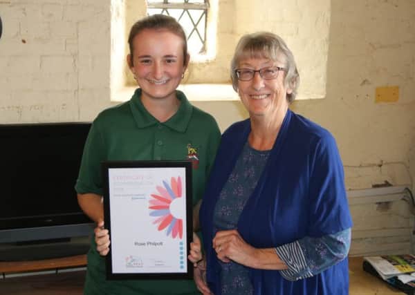 Rose Philpott, 19, was presented with the Certificate of Commendation by gardening guru Jean Griffin for her efforts as part of Arundel Castle's gardens team