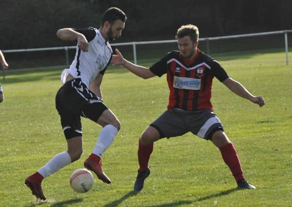 Bexhill United winger Jack McLean tries to take on an opponent during last weekend's 1-0 win at home to Wick. Pictures by Simon Newstead