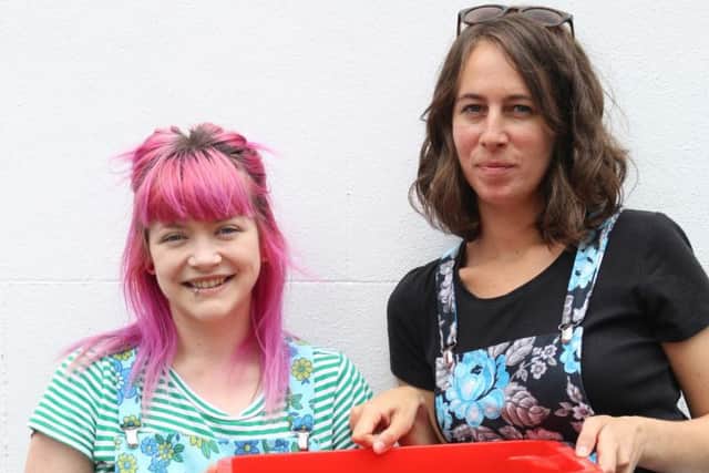 Cecily and Louisa with one of the Red Box Project boxes