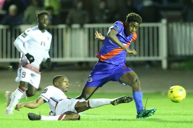 Lanre Azeez slides in to a tackle at The Pilot Field on Tuesday night