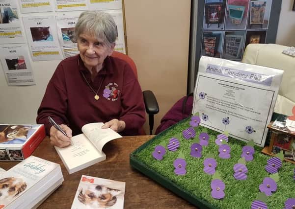 Barby Keel, signing copies of her 2nd book, Gabby, The Little Dog Who Had to Learn How to Bark. SUS-180611-144322001