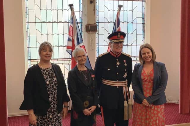 Sarah Marzaioli BEM and HM Lord Lieutenant for East Sussex, Mr Peter J Field  flanked by colleagues Abi Turners and Anitia Smith SUS-181121-150612001