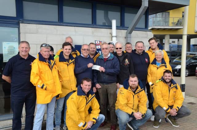 The cheque was presented to lifeboat treasurer Keith Stevens by Martin Wellings and Alan Young. SUS-180511-124859001
