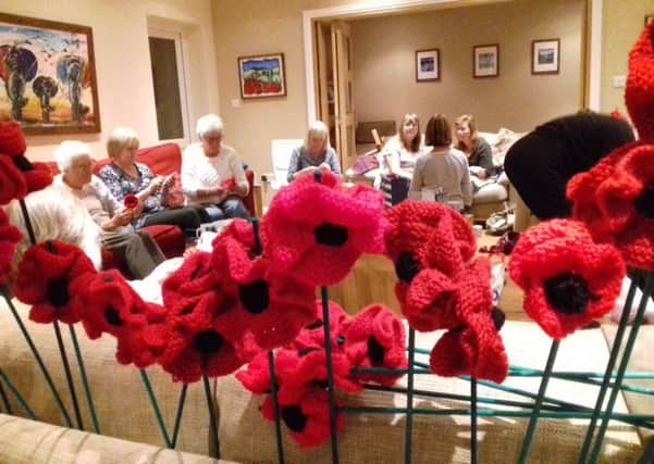 Poppies in production with the knitters from Maybridge Community Church