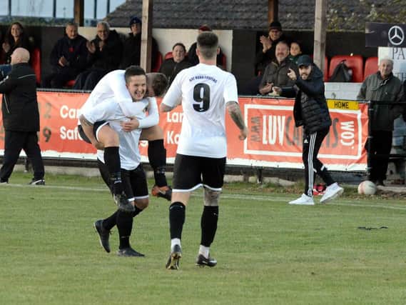 Pagham celebrate a goal on the way to beating Peacehaven / Picture by Kate Shemilt