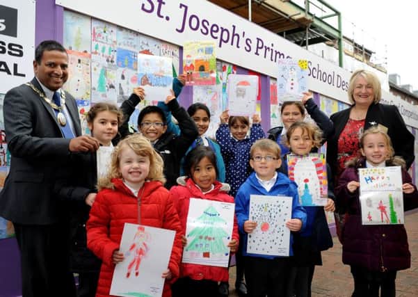 Children from St Joseph's Primary School being awarded prizes for their Christmas cards at The Orchards in Haywards Heath last year. Picture: Steve Robards