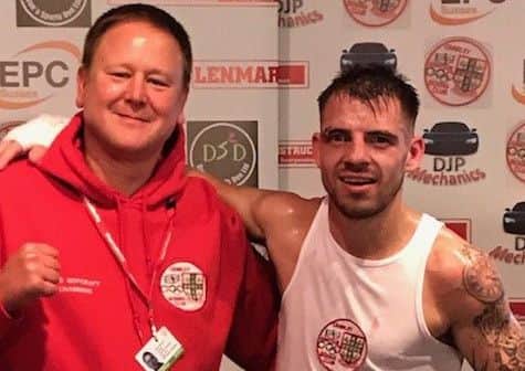 Chairman Rees Hopcraft with James Verbeeten at the Crawley Boxing Club show at Goffs Park Social Club SUS-180511-160111002