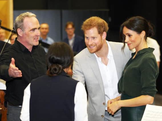 Crispin (left) chats to the Duke and Duchess of Sussex on their recent visit to the university