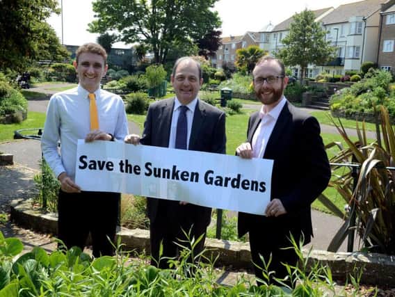 ks180245-4 Bog Sunken Garden phot kate'From left:: District councillors Martin Smith,Francis Oppler, and Matt Stanley discuss the campaign to save the sunken gardens.ks180245-4 SUS-180522-151720008