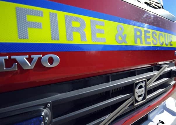 Two fire engines and a heavy rescue unit were sent to the overturned trailer