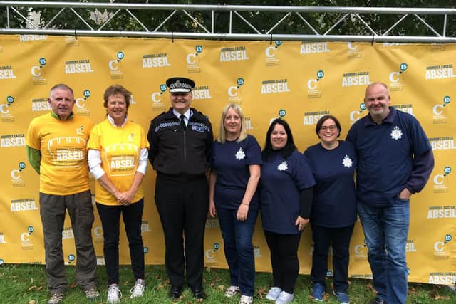 Derwyn Jones, Chestnut Tree House's chairman of trustees, Caroline Nicholls, High Sheriff of West Sussex, Giles York, chief constable of Sussex Police and members of the force