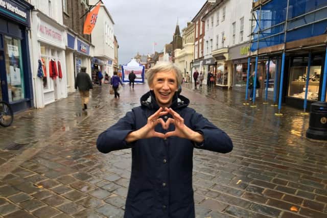 Louise Goldsmith, in Chichester's North Street loving the city centre despite the rain