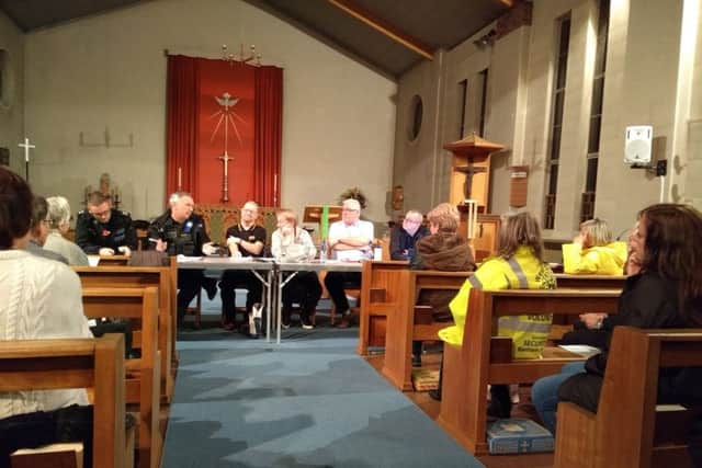 Councillors and police officers field questions at St Richard's Church in Goring SUS-180811-104959001