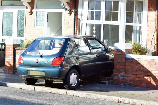 A car collided with a house in Wannock Road this morning, photo by Dan Jessup