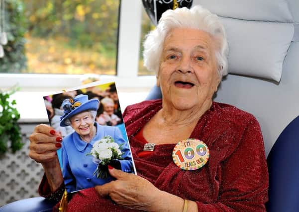Jeanie Clark with the birthday card she received from the Queen on her 100th birthday. Picture: Steve Robards SR1830307