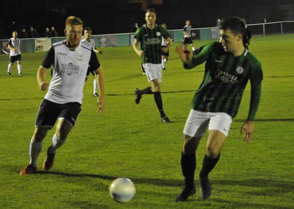 Zack McEniry closes down an opponent during Bexhill United's 1-0 defeat at home to Burgess Hill Town on Tuesday night. Picture by Simon Newstead