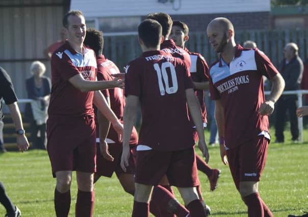 Little Common Football Club celebrates scoring in its last home game, against Hassocks, on October 20