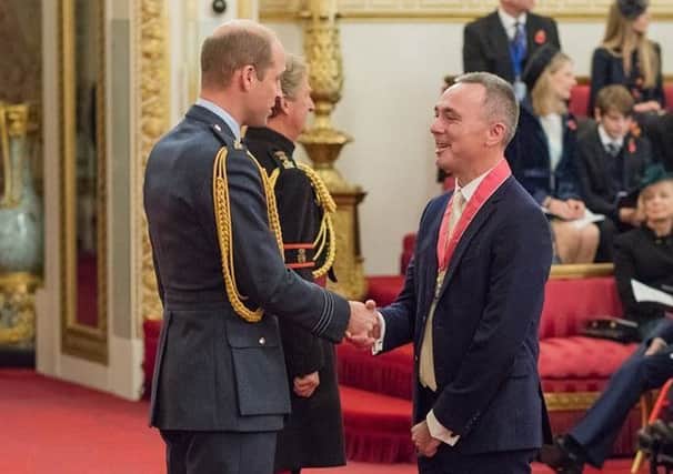 Ryan Campbell is presented with a CBE by His Royal Highness Prince William of Wales SUS-181113-140924001