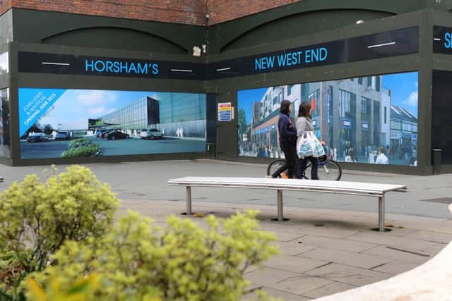 Hoardings up around the former McDonald's unit showing aerial artists' impressions of the completed West End Horsham development. Pic Steve Robards SUS-150605-130554001