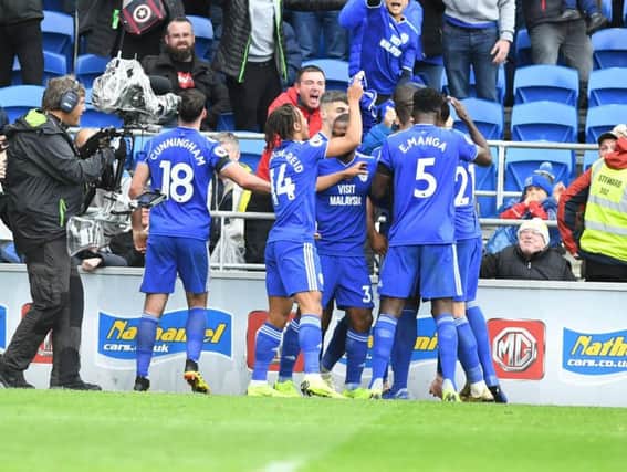 Cardiff celebrate Sol Bamba's winner - team-mate Bobby Decordova-Reid (14) is holding Bamba's shirt. Picture by PW Sporting Photography