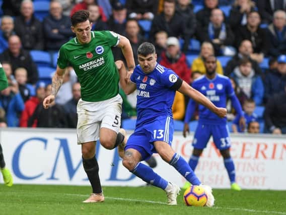 Lewis Dunk looks to close down Callum Paterson during Brighton's match at Cardiff on Saturday. Picture by PW Sporting Photography