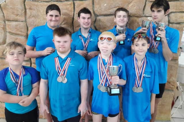 Some of the squad with medals and trophies