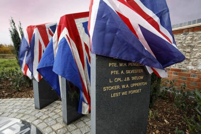 The centenary stone draped in Union Jacks SUS-181211-131928001