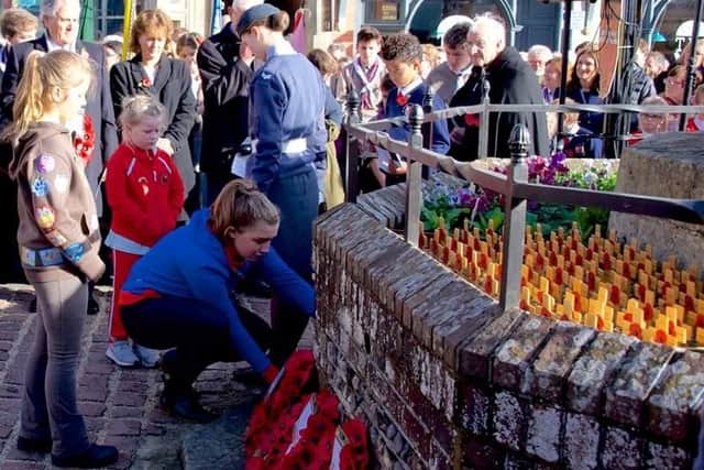 Hundreds turned out in Arundel to pay their respects to the soldiers who died in the First World War on the centenary of Armistice Day yesterday. Picture: Charles Waring