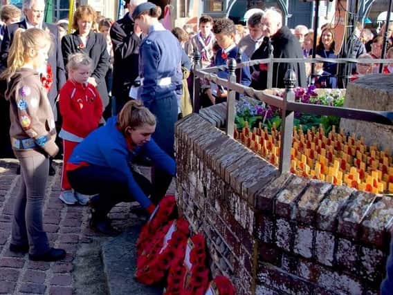 Hundreds turned out in Arundel to pay their respects to the soldiers who died in the First World War on the centenary of Armistice Day yesterday. Picture: Charles Waring