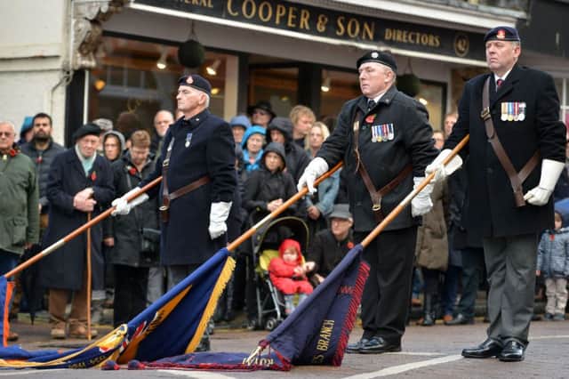 Royal British Legion standards lowered in salute