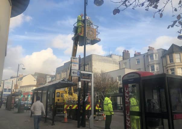 Christmas lights have started going up in Queens Road. Picture: Maria Hudd