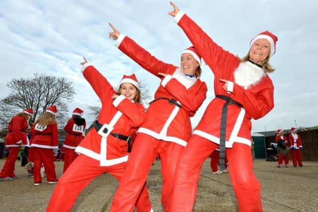 Participants in the first Lewes Santa Run last year. Photograph Peter Cripps (SUS-170312-093047001)