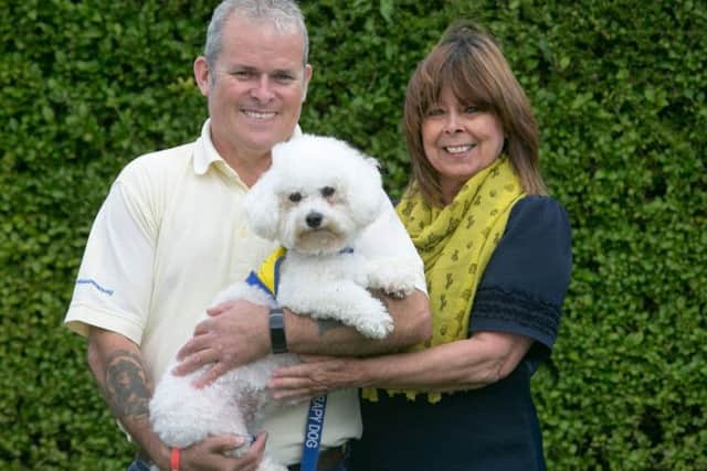 Bella with her owners Barry and Petra