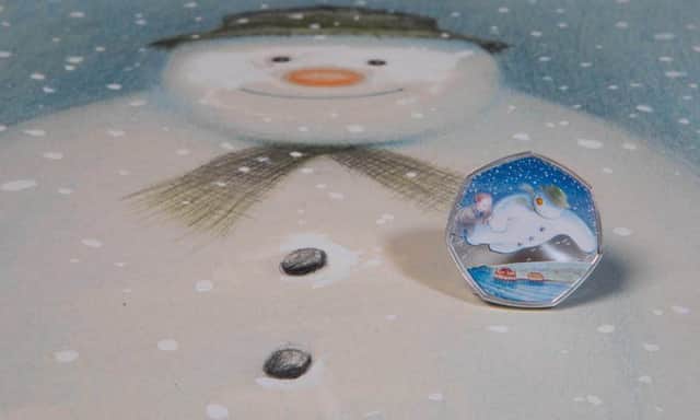 The Snowman and Brighton Palace Pier feature on the special edition coin (Credit: The Royal Mint/Penguin Ventures)