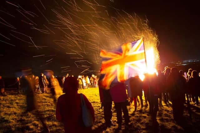 The beacon lighting in front of the Union Jack. Photo credit, Alex Benwell