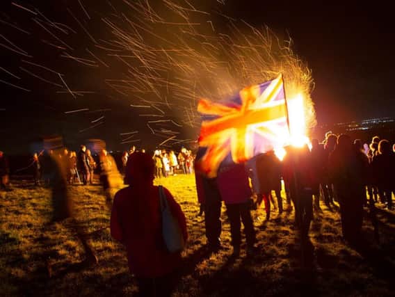 The beacon lighting in front of the Union Jack. Photo credit, Alex Benwell