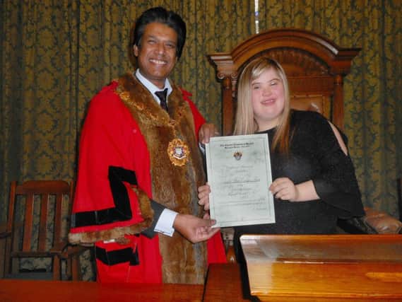 Elly Frost receives a special award from Bexhill mayor, Cllr Abul Azad. Photo by Margaret Garcia. SUS-181113-153745001