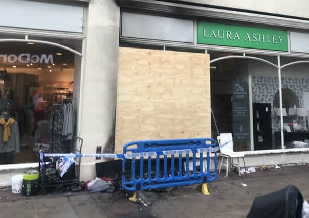 The woman set fire to the man's bedding and the flames spread to the Laura Ashley store
