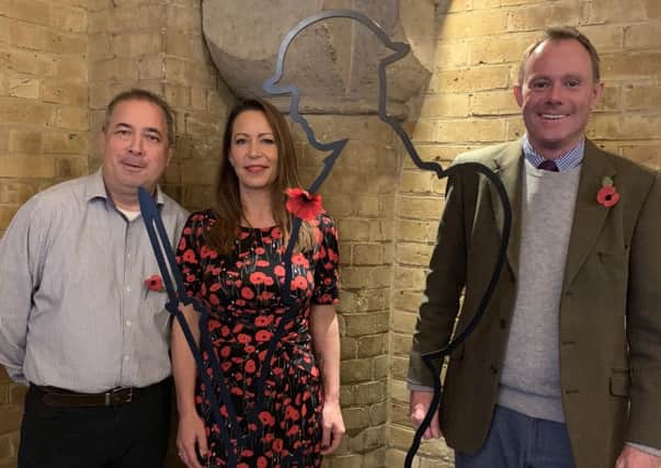 Nick Herbert with his constituency assistant Michelle Taylor and Michael Tu, former Mayor of Arundel and trustee of the There But Not There campaign, alongside one of the Tommy silhouettes in Arundel Town Hall