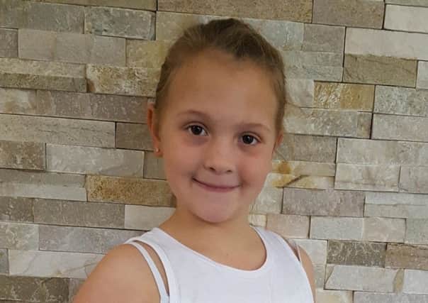 Martha Robinson, aged seven, has taken up a 'marthon in a month' fundraiser for Chestnut Tree House and Alzheimer's Research SUS-181114-134848001