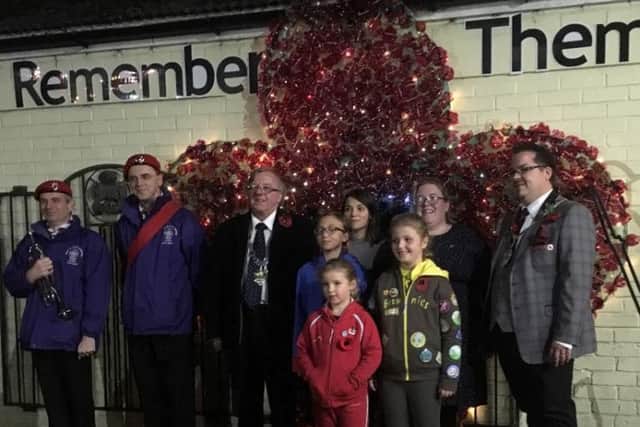 Members of Girlguiding Littlehampton and Arundel and The Scouts Association helped to unveil the poppy