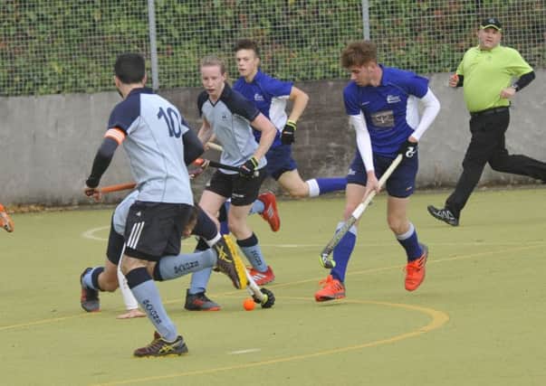 Nick Taylor lunges in to a tackle during South Saxons' 3-1 victory over Folkestone seconds. Pictures by Simon Newstead
