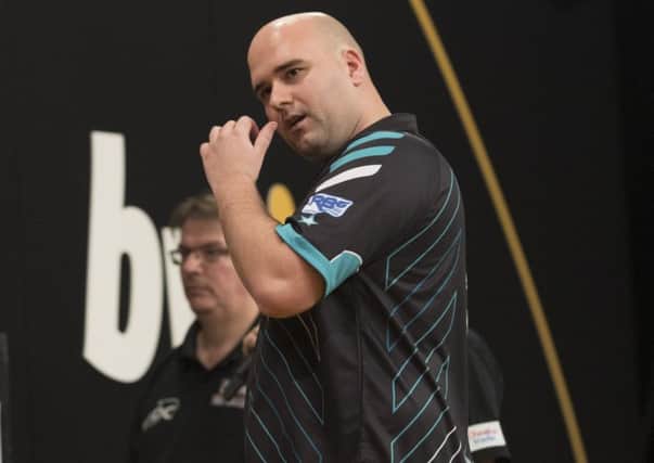 Rob Cross on stage during his defeat to Mensur Suljovic at the bwin Grand Slam of Darts last night. Picture courtesy Lawrence Lustig/PDC