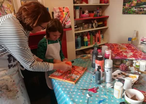 Amelie and Lily like to paint together at home