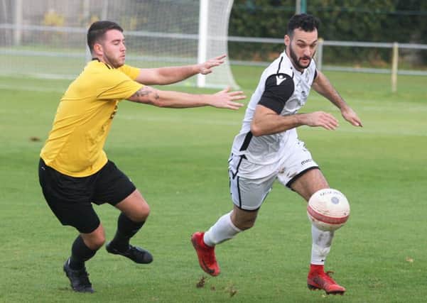 Jack McLean tries to take on a Littlehampton Town opponent during Bexhill United's 1-0 victory last weekend. Picture by Derek Martin Photography
